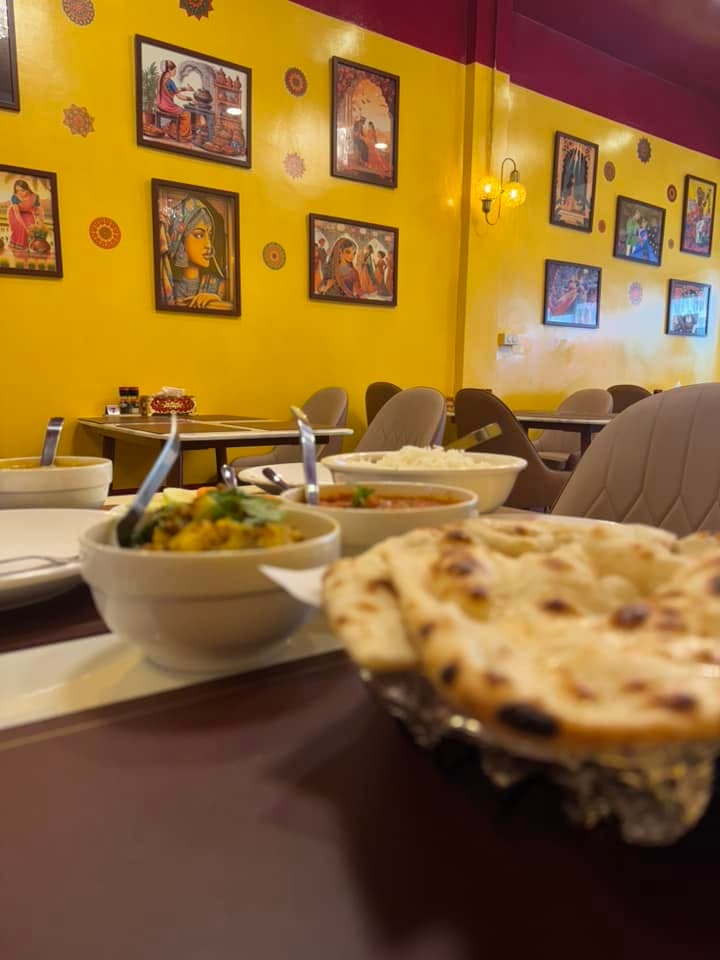 A fresh table spread โ dal, curry, rice, and naan in our dining room
