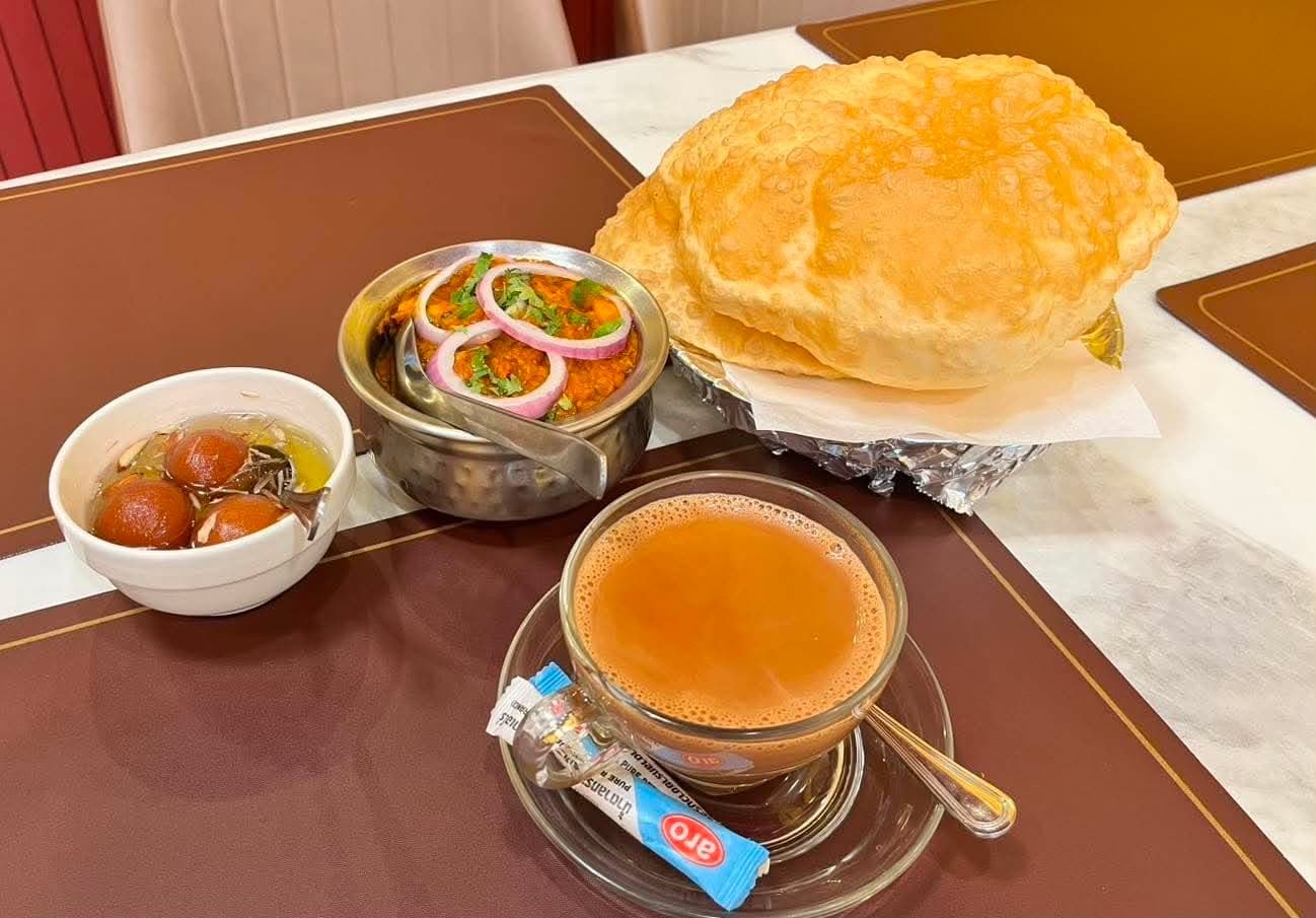 Chana masala served with puffed puri bread
